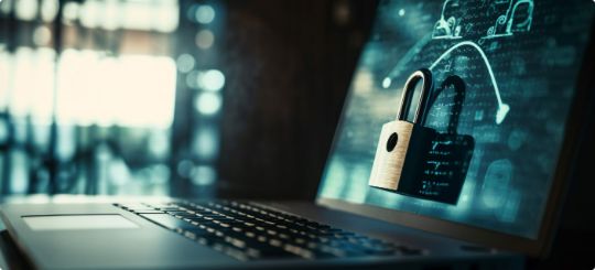 A laptop computer with a padlock symbol on its screen. The padlock is a widely recognized symbol for security and privacy.